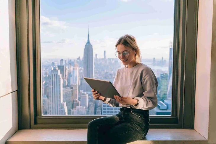 New York young woman by the window