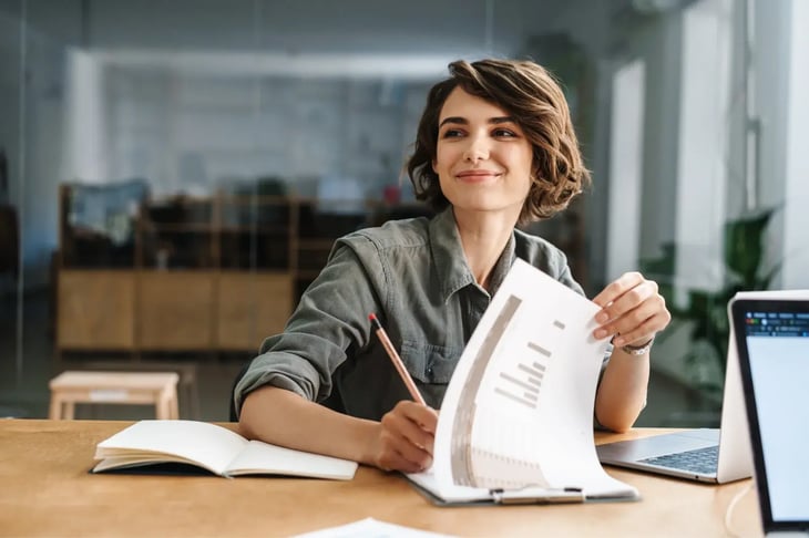 Young woman filling papers